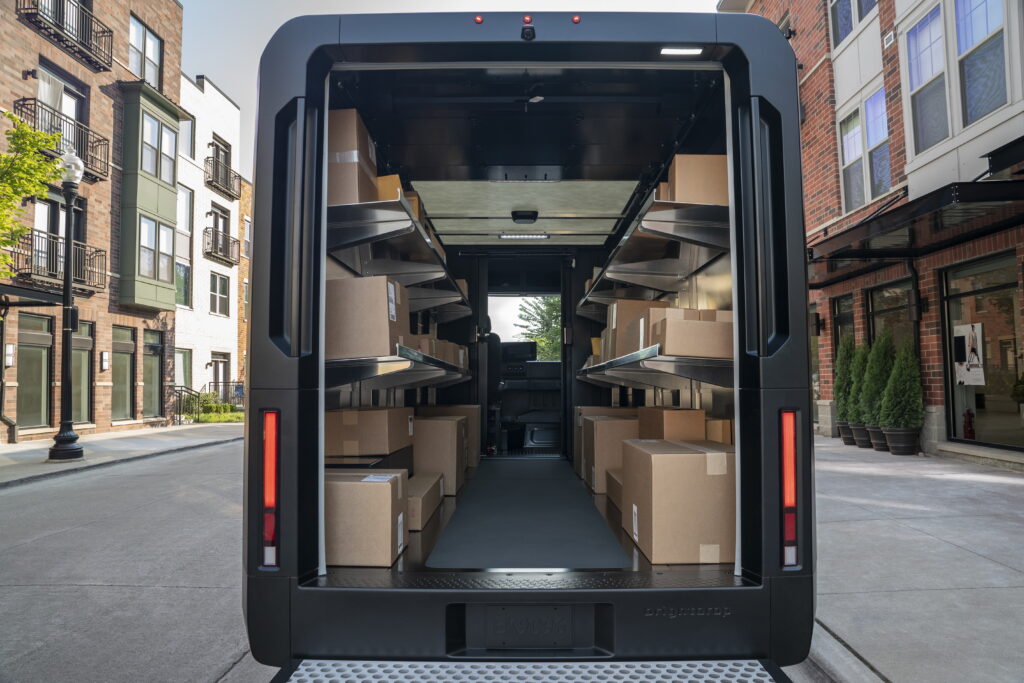 Image shows an electric step van from the back, with doors open revealing the cargo area.